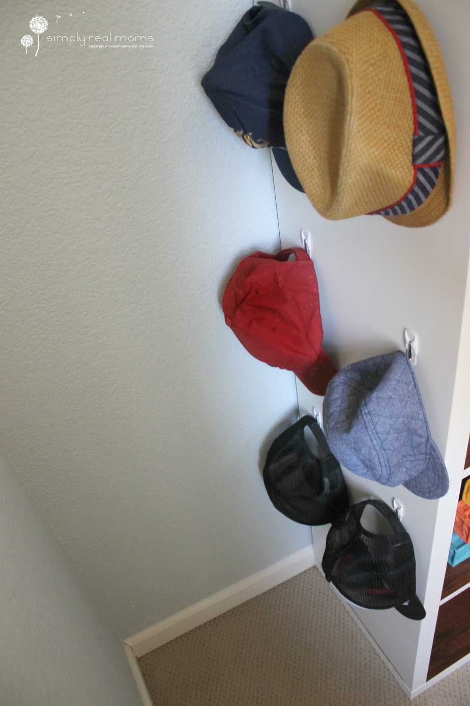Hang hats on the side of the bookshelf!