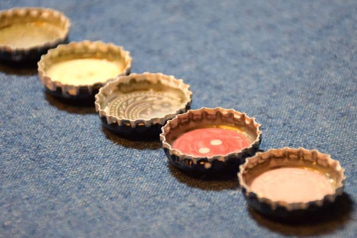 Use recycled bottle caps to make personalized diy magnets that are fun for kids and awesome as diy gift ideas!