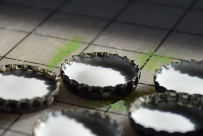 Use recycled bottle caps to make personalized diy magnets that are fun for kids and awesome as diy gift ideas!