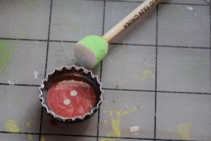 Use recycled bottle caps to make personalized diy magnets that are fun for kids and awesome as diy gift ideas!
