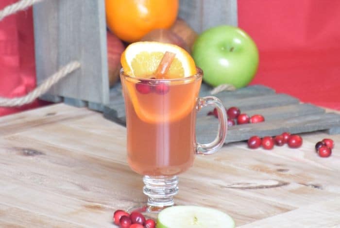 Get a taste of the Christmas with this sweet and tangy cranberry orange spiced cider recipe. Easily made in your crockpot and truly a healthy treat since the only sugar comes from your fruit!