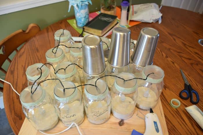 How to make solar powered mason jar lights with with string lighting. Beautiful outdoor mason jar lighting.
