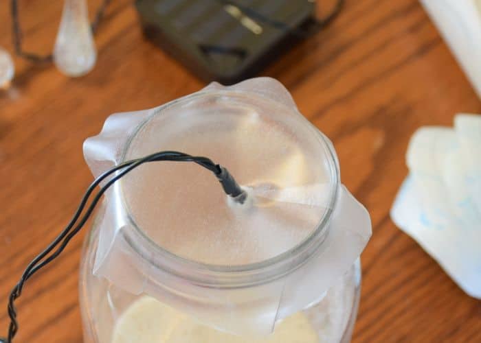 How to make solar powered mason jar lights with with string lighting. Beautiful outdoor mason jar lighting.