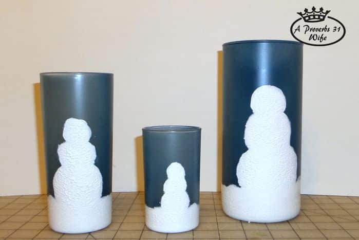 Painted snowmen on blue jar