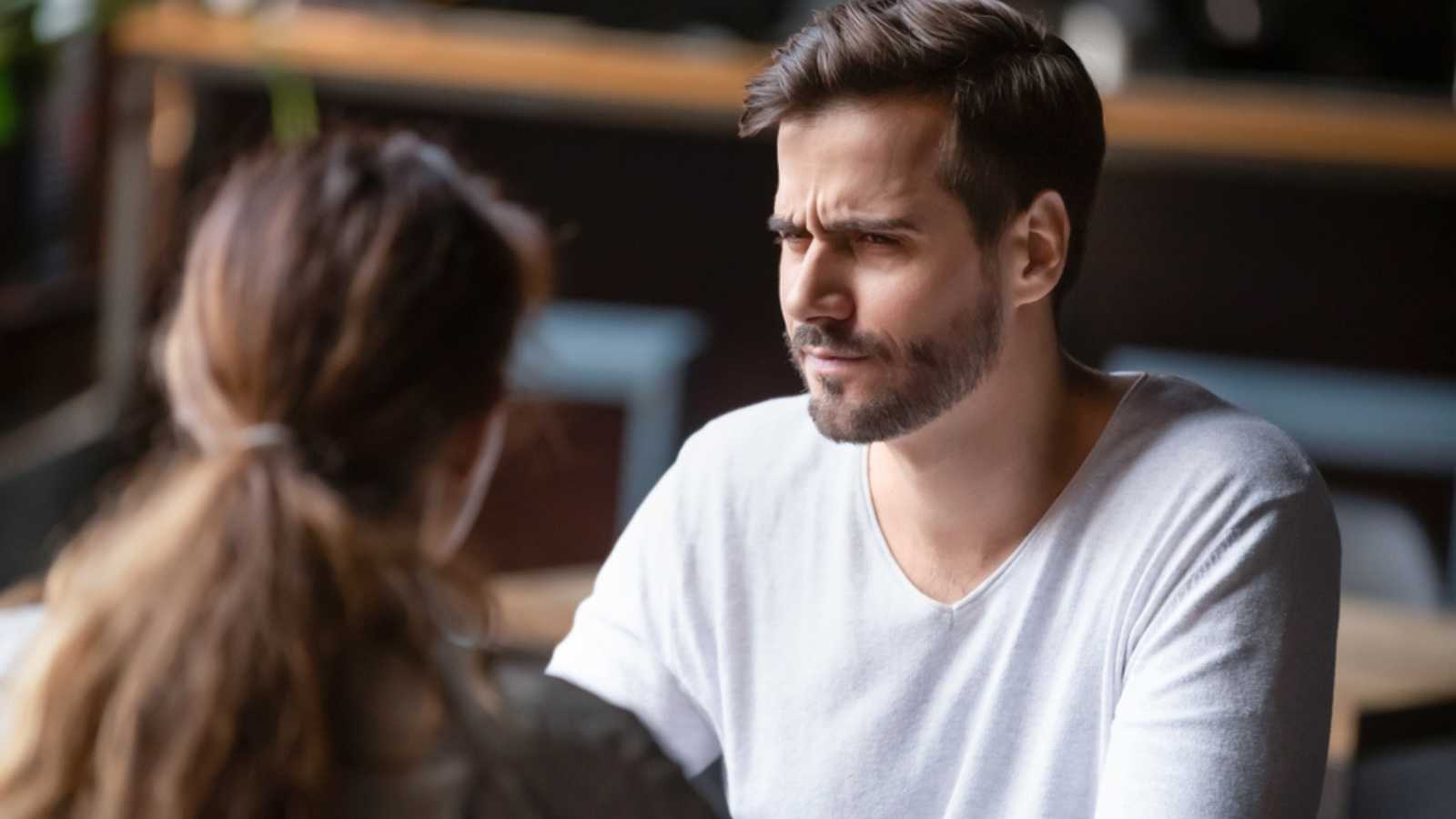 Man looking at woman