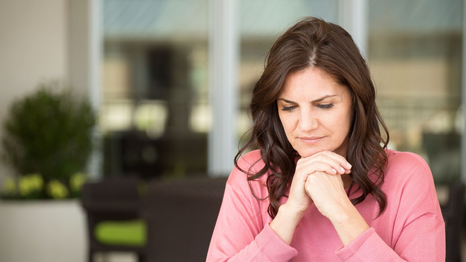 Middle age woman looking sad.