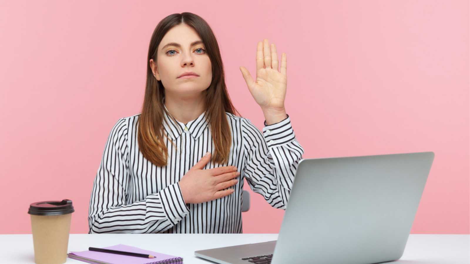 Woman with hand on her chest