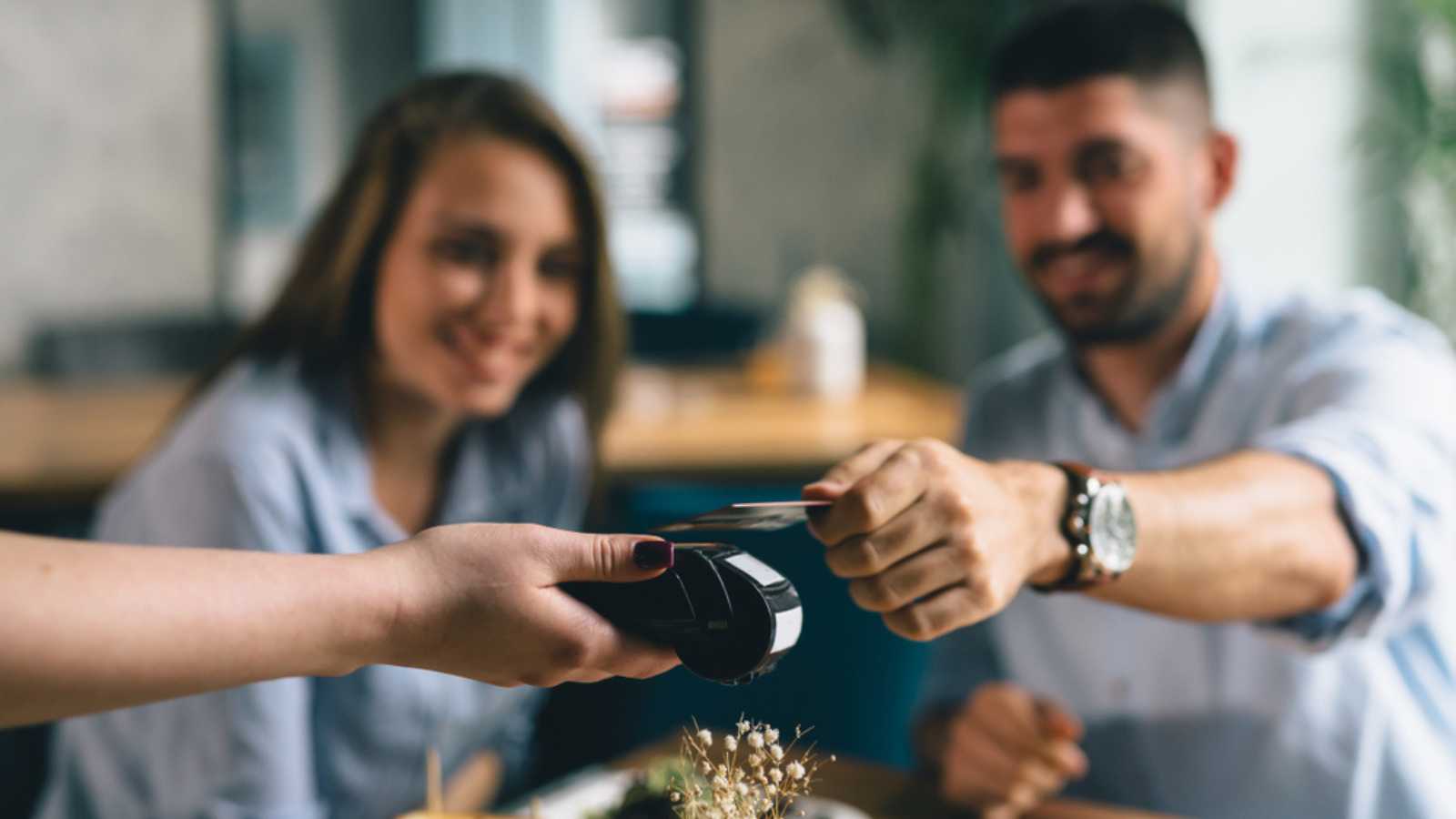Man paying bill in restaurant
