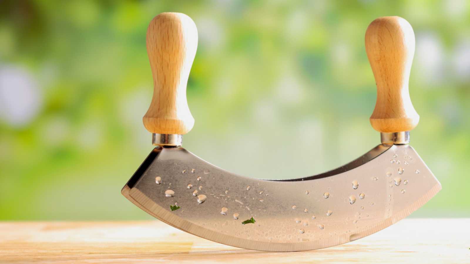 Close up of a modern herb cutter with a blurred background.