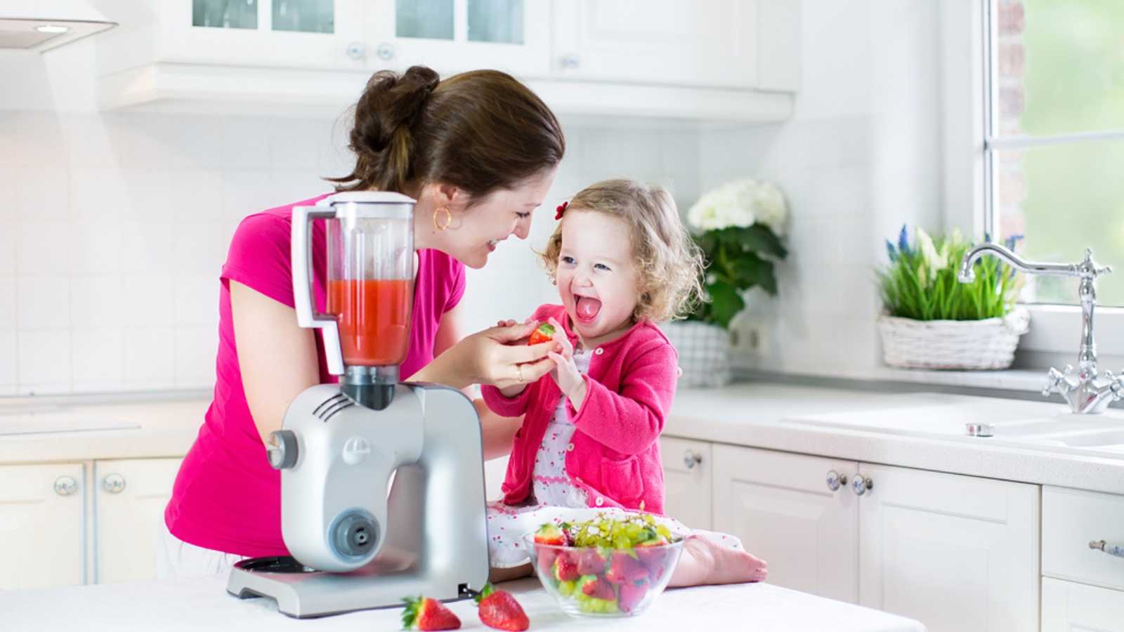 Woman using blender